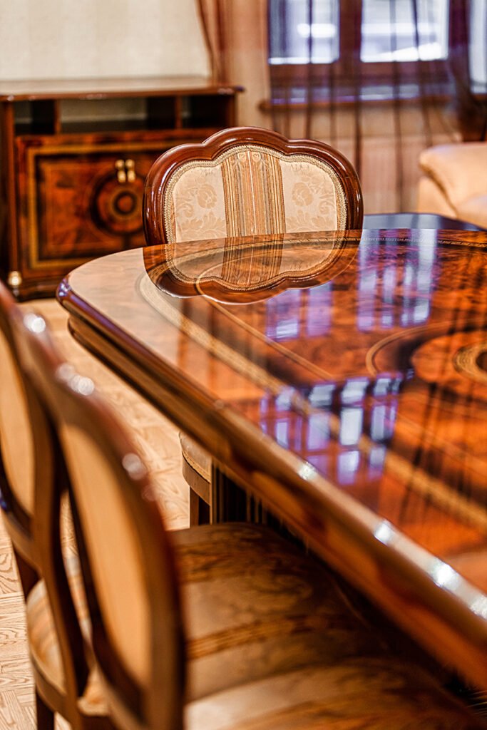 Elegant Dining Room with Polished Wooden Table and Ornate Chairs